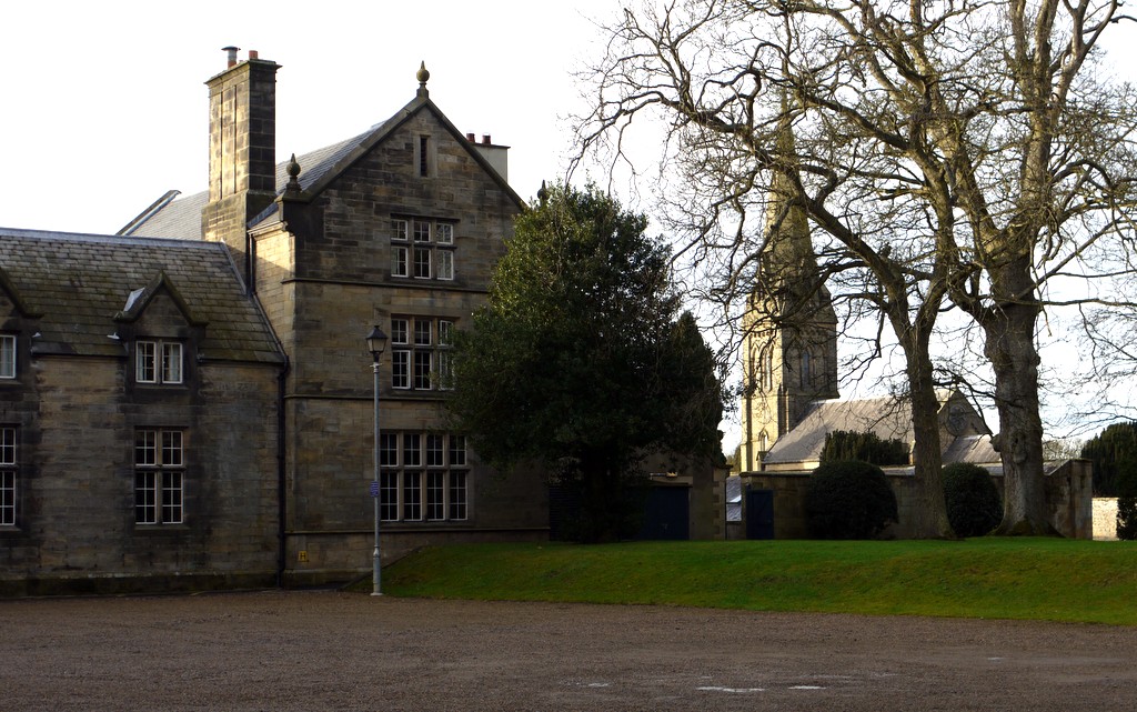 North wing of Matfen Hall beside the neighbouring church